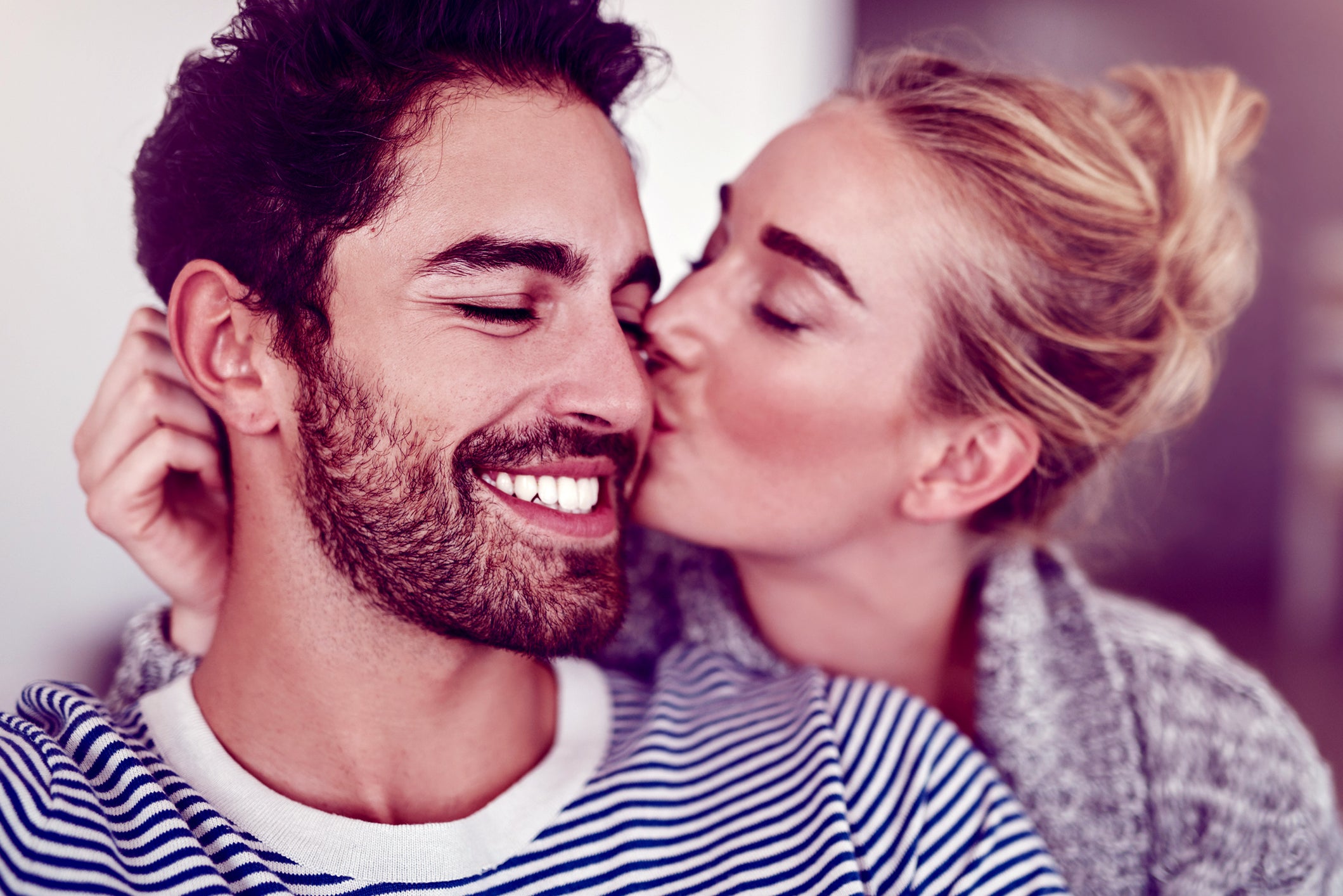 women kiss a men
